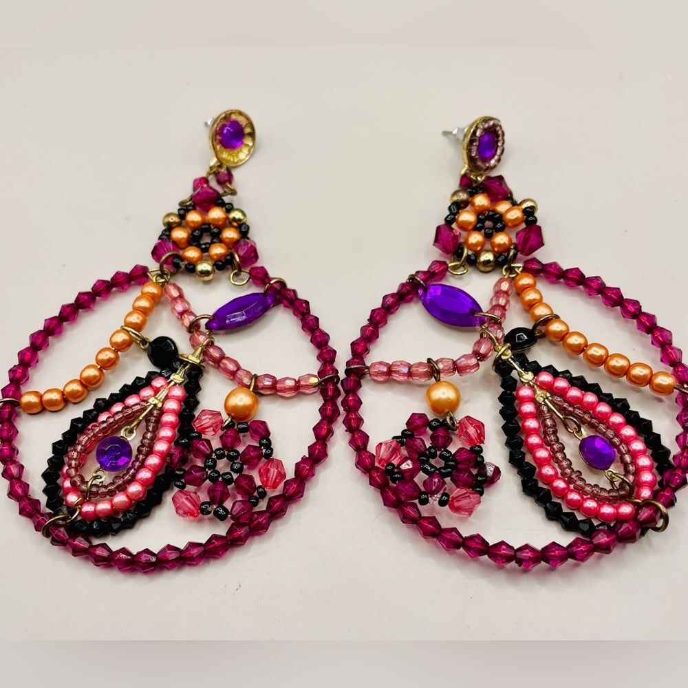 Beaded hoop earrings. Purple, pink, and peach beads with purple rhinestones.